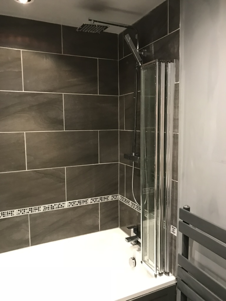 Modern grey tiled bathroom